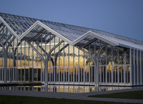 A glass conservatory at dusk at Longwood Gardens.