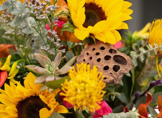A floral arrangement featuring bright sunflowers.