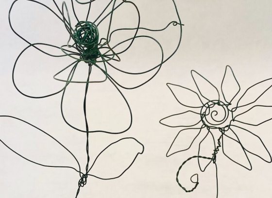2 flower outlines created with metal wire