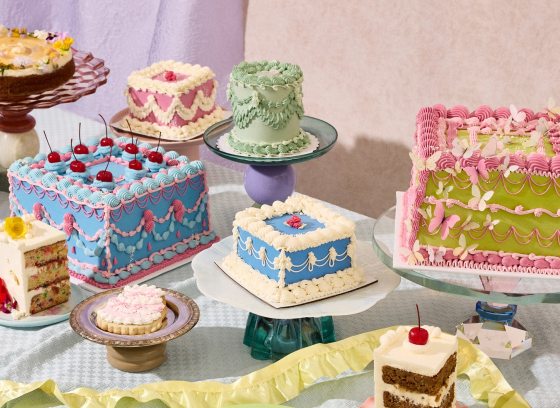 A variety of vintage style cakes decorated and on display.