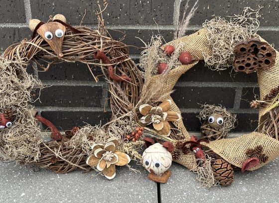 Two wreaths hand decorated with natural materials 