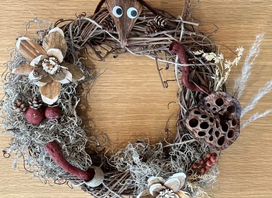 Grapevine wreath decorated with natural materials