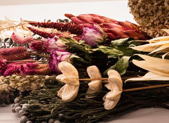 A variety of dried floral material in a range of colors. 