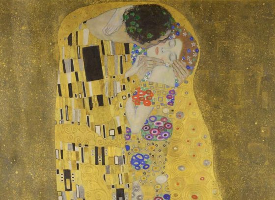 A painting called The Kiss by Gustave Klimt showing a couple on a gold background.