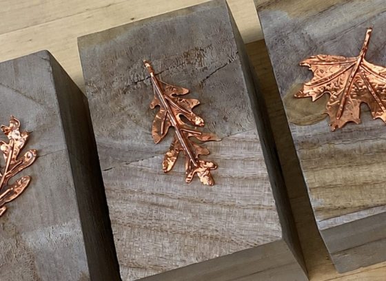 3 handcrafted leaves made out of hammered copper