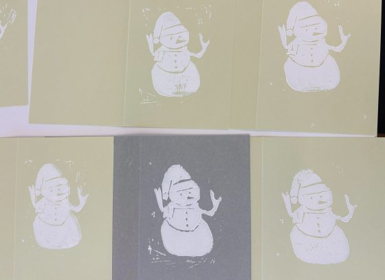 Handmade cards, featuring a printed snowman in white ink.
