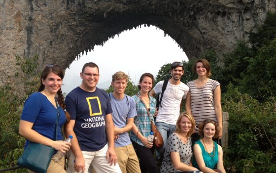 a group of professional gardener students pose for a photo in front of an arch in 2012
