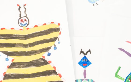 a colorful child's drawing of a butterfly and other bugs