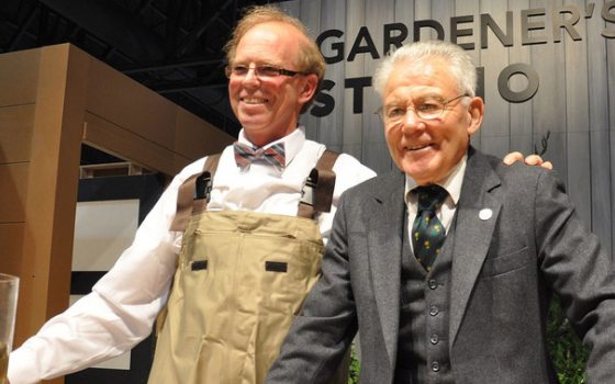 two individuals pose together at the Philadelphia Flower Show