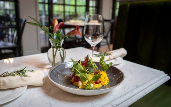 plate of food set on a white table 