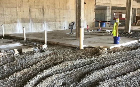 construction site with beams and gravel