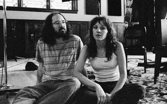 Two adults sitting together