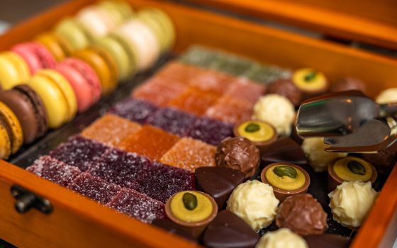 closeup of dessert box with various cookies and candies