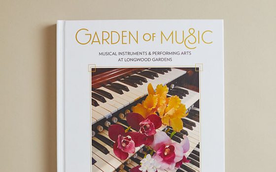 A book cover of Gardens of Music.