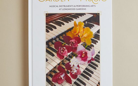 A book cover of Gardens of Music.