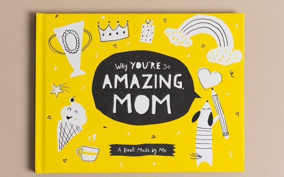 A yellow and black book that read Amazing Mom on the cover.