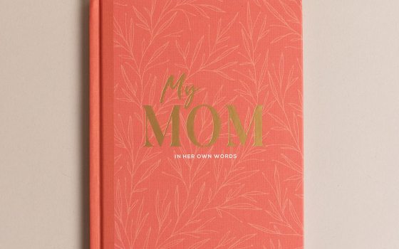 A salmon colored book with the words My Mom in gold on the cover.