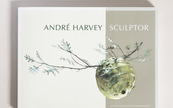 A book with a white and gray cover, featuring the words Andre Harvey Sculptor.