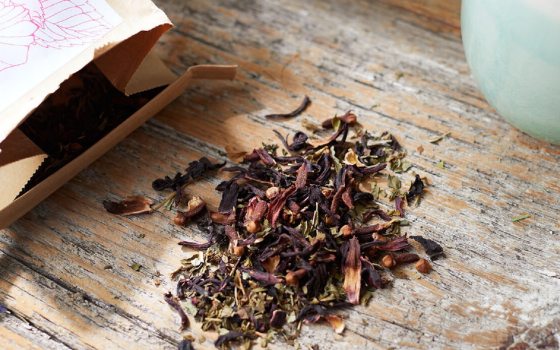 Loose leaf tea on a wood table.