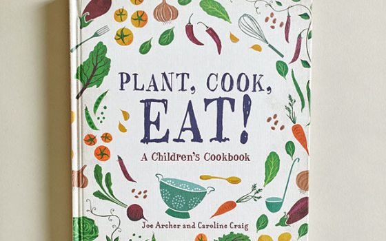 A book titled "Plant, Cook, Eat!" with a colorful cover featuring vegetables and plant illustrations.