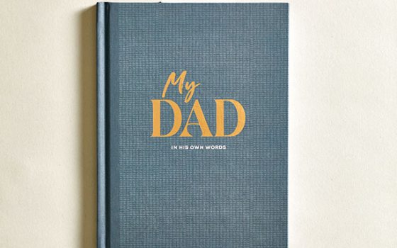 A navy blue book titled "My Dad."