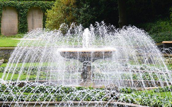 view of the italian water garden fountain with water spraying