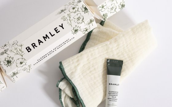 A tube of lotion, washcloth, and a box reading "Bramley" in black text.