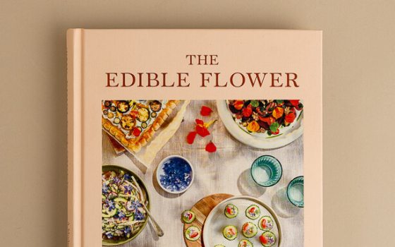 A book featuring the title :The Edible Flower" in red text. 