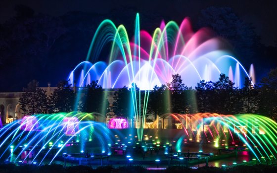 Wide view of multi-colored fountain garden.