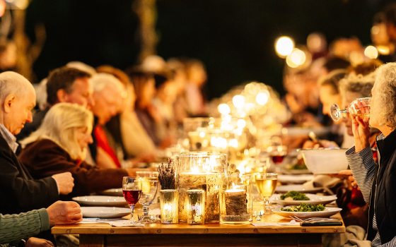 candlelit dinner outside in a field