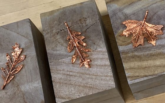 3 handcrafted leaves made out of hammered copper