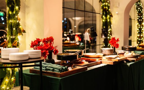 A buffett set up inside a holiday event space at Christmas.