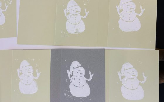 Handmade cards, featuring a printed snowman in white ink.