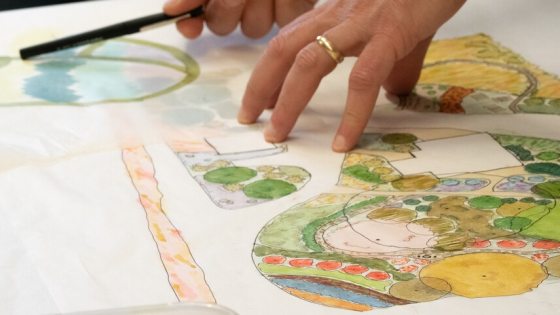 A person creating a landscape design plan.