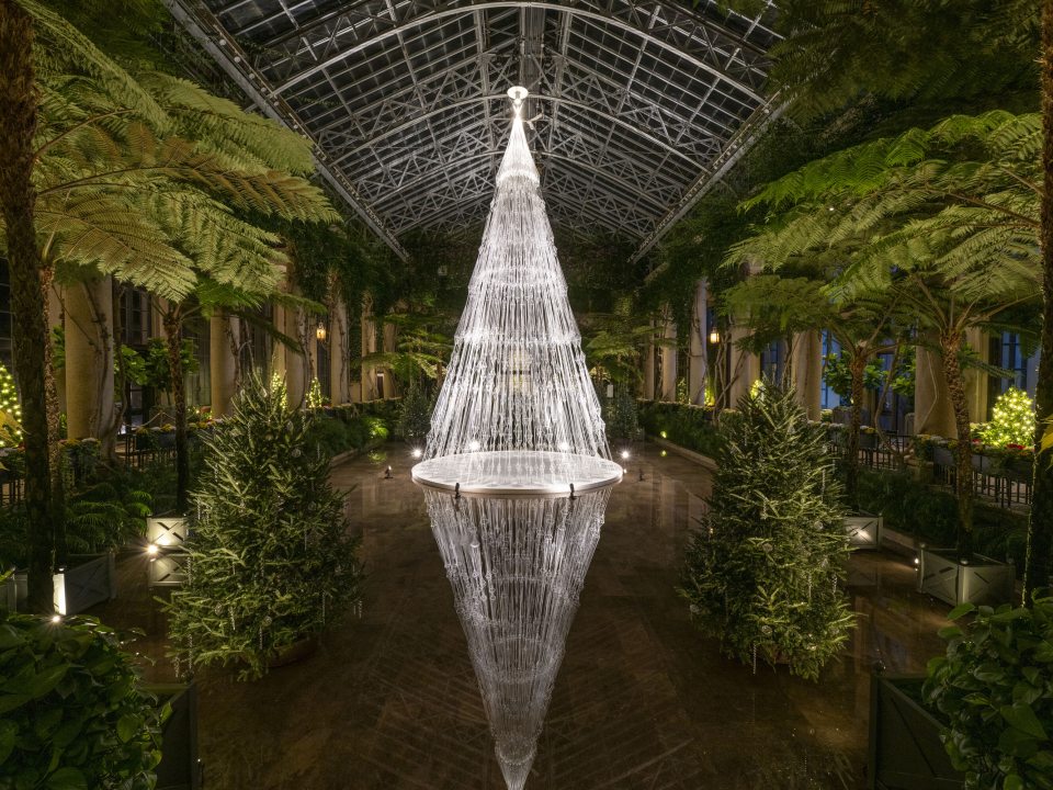White strings with geometric shapes in them, put together to look like a white lit Christmas tree at Longwood Gardens.