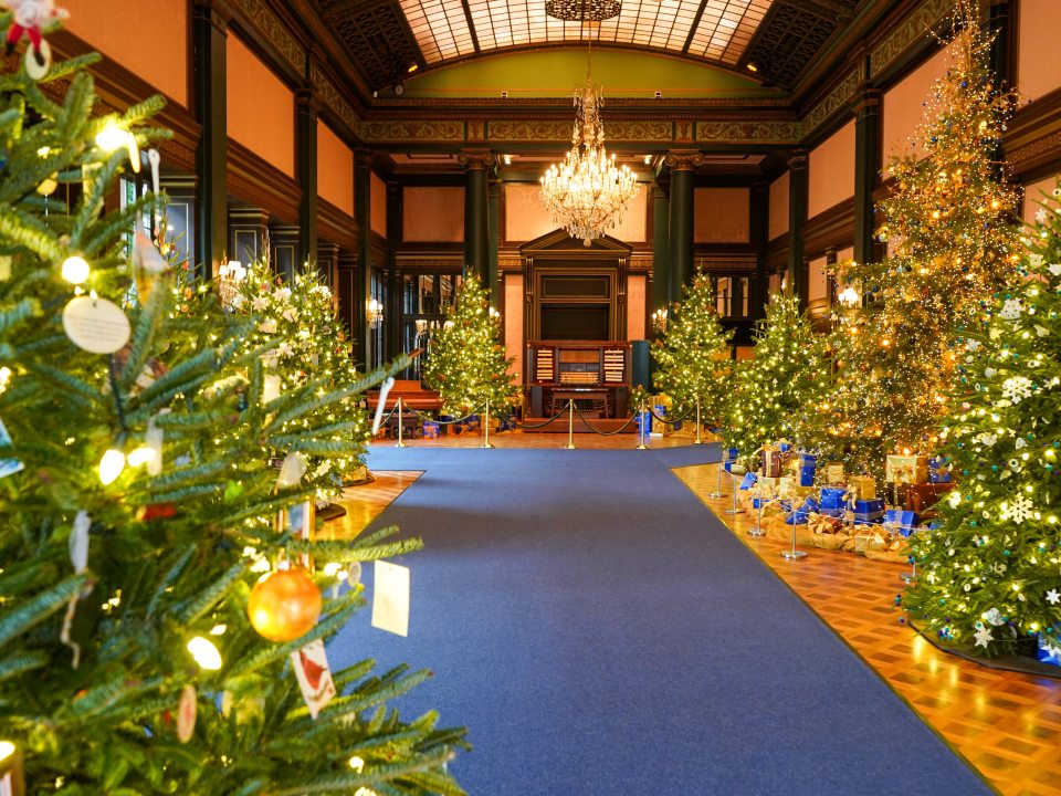 The Ballroom at Longwood Gardens willed with Christmas trees.