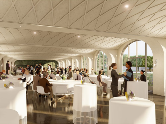 Computer-designed image of a large dining space filled with round tables covered with white tablecloths, populated by guests in business attire, with a view of gardens through large arched windows.