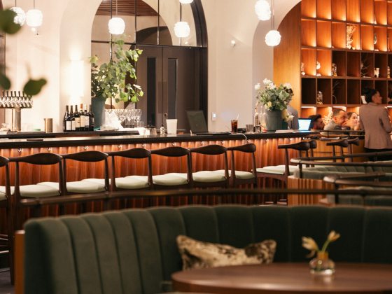 a row of chairs at a bar