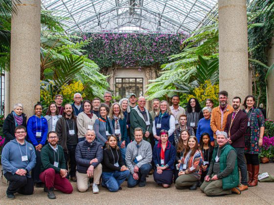 A large gropu photo staged in the Longwood Gardens conservatory.
