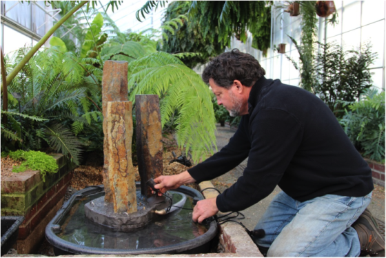 Artisan Robert Wertz installing a fountain
