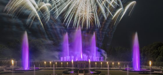 landscape image of the Main Fountain Garden performance with fireworks above