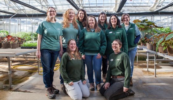 a group of Longwood staff in a greenhouse 