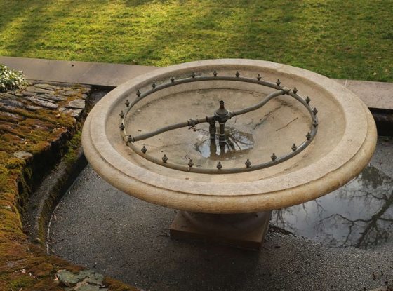oval outdoor fountain without water 