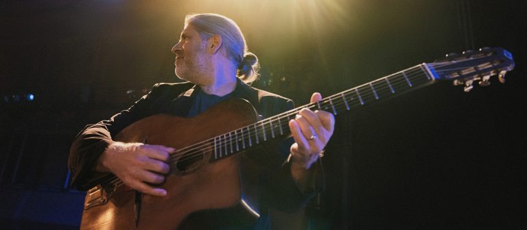 Adult playing the guitar