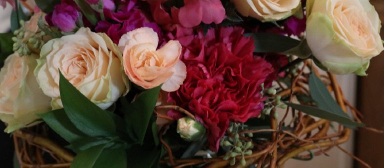 flower arrangement with red and pink roses