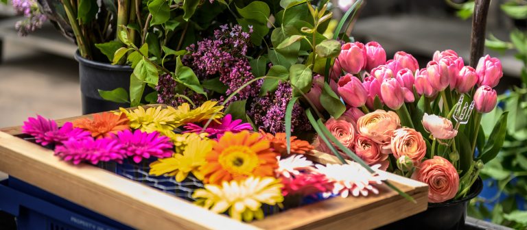 bouquets of cut flowers on a cart