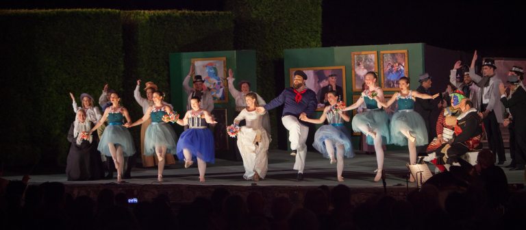 performers in costume dancing on stage