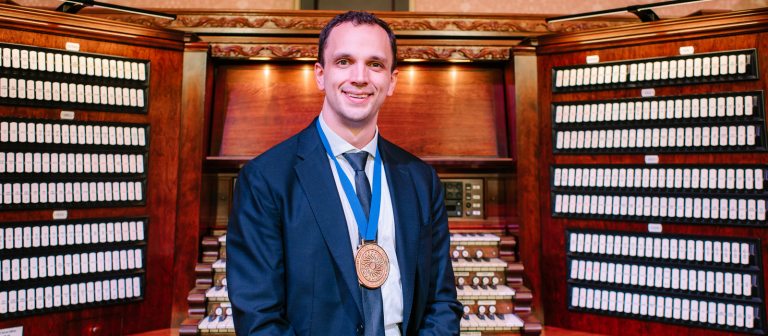 Organist sitting at the organ console