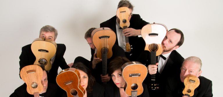 Adults holding ukuleles