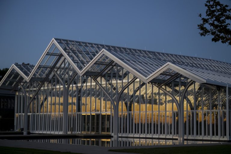 A glass conservatory, with peaked roof lines, at Longwood Gardens.